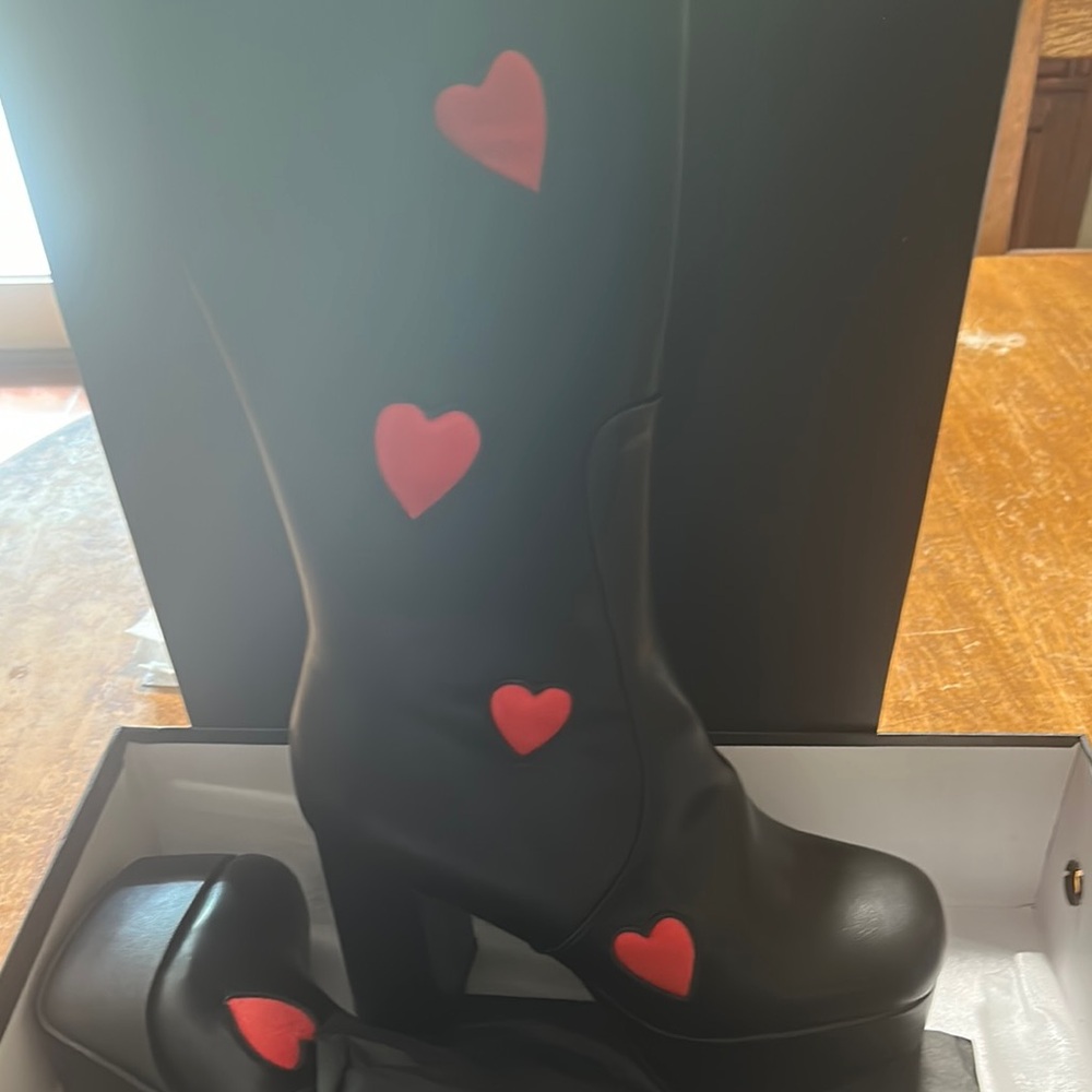 Chic Black Heeled Boots with Red Heart Details